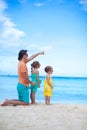 Happy father with his two daughters sitting on Royalty Free Stock Photo