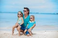 Happy father with his two daughters sitting on Royalty Free Stock Photo