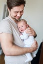 Happy father holding newborn baby in his arms Royalty Free Stock Photo