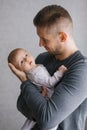 Happy father holds his baby son in his arms Royalty Free Stock Photo