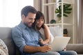 Happy father with kid laughing watching funny video on laptop Royalty Free Stock Photo