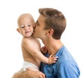 Happy father kissing baby boy isolated on white Royalty Free Stock Photo