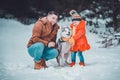 Happy father and little daughter and husky dog in winter forest walking in winter Royalty Free Stock Photo