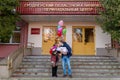 Happy father meets his wife with a newborn baby