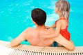 happy father parent with a child in the swimming pool is played outdoors in the summer park Royalty Free Stock Photo