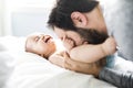 Happy father playing with adorable baby in bedroom Royalty Free Stock Photo