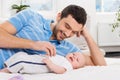 Happy father playing with a baby Royalty Free Stock Photo