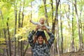 Happy Father Playing with Cute Baby daughter in Autumn Woods Royalty Free Stock Photo