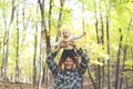 Happy Father Playing with Cute Baby daughter in Autumn Woods Royalty Free Stock Photo