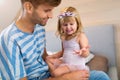 Father Playing with Daughter At Home