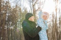 Happy father playing with little child son boy in winter nature Royalty Free Stock Photo