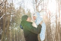 Happy father playing with little child son boy in winter nature Royalty Free Stock Photo