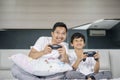 Happy father playing video games with his son Royalty Free Stock Photo