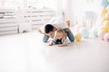 Happy father plays with his son celebrating first birthday of baby boy Royalty Free Stock Photo