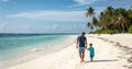 Happy father\'s day,A man and a young child are walking hand-in-hand along a sandy beach. Royalty Free Stock Photo