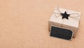 Happy Father`s Day Background. Beautiful retro style gift box and black bow tie on brown background.