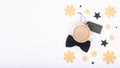 Happy Father`s Day Background. Cup of coffee and black bow tie on white background flat lay. Floral Fathers day still life. Royalty Free Stock Photo