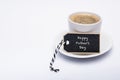 Happy Father`s Day Background. Cup of coffee on white background with gift tag.