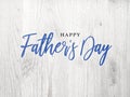 Happy Father`s Day Blue Calligraphy Script Over White Wood
