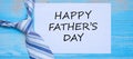 Happy Father`s Day with blue neckties on wooden background. International Men`s Day concepts