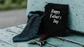 Happy father's day card with blue tie and hammer on rustic bench Royalty Free Stock Photo