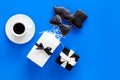 Happy Father`s day cards. Black tie, mustache and hat cookies and gift. Blue background top view copyspace Royalty Free Stock Photo