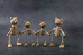 Happy father`s day concept. Greeting card with family of wooden toy bears on dark background. Royalty Free Stock Photo