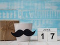 Happy father`s day concept. 17 June wooden block calendar, gift