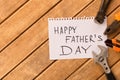 Happy father`s day . Different tools on wooden background