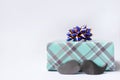 Happy Father`s Day gift box with mustache on light table Royalty Free Stock Photo
