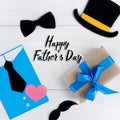 Happy father`s day.Gifts and postcard on a white wooden backgroundI love you, dad.Love and health in the family.square Royalty Free Stock Photo