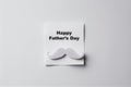 Happy Father\'s Day greeting card with a mustache on a white background. Generative AI