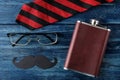 Happy father`s day. men`s tie, glasses and men`s accessories on a blue wooden table. men`s holiday. top view Royalty Free Stock Photo