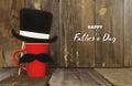 Happy father`s day.A red mug with a mustache and a top hat on a rustic rustic background.A greeting card or banner for your store Royalty Free Stock Photo