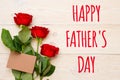 Happy father`s day, 3 red roses with empty craft paper card