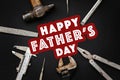 Happy father`s day text sign on working tools hammer wrench plie Royalty Free Stock Photo
