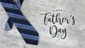 Happy Father`s Day Text with Striped Tie Over Wood Background Royalty Free Stock Photo