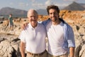 Happy father and son with arms around looking at camera Royalty Free Stock Photo