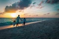 Happy father with son and daughter play on sunset beach Royalty Free Stock Photo