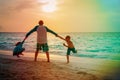 Happy father with son and daughter play on sunset beach Royalty Free Stock Photo