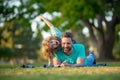 Happy father and son enjoying summer time on vacation in a sunny park. Concept of healthy holiday and family activity. Royalty Free Stock Photo