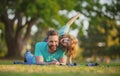 Happy father and son enjoying summer time on vacation in a sunny park. Concept of healthy holiday and family activity. Royalty Free Stock Photo