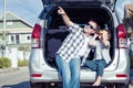 Happy father and son getting ready for road trip on a sunny day Royalty Free Stock Photo