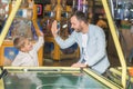 happy father and son giving high five while playing air hockey Royalty Free Stock Photo