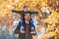 Father and son having fun in autumn park Royalty Free Stock Photo