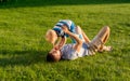 Happy father and son having fun outdoor on meadow Royalty Free Stock Photo