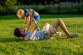 Happy father and son having fun outdoor on meadow Royalty Free Stock Photo