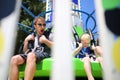 Happy Father and Son Having Fun Riding a Carnival Ride on a Summer Day Royalty Free Stock Photo