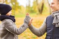 Happy father and son making high five in park Royalty Free Stock Photo