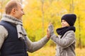 Happy father and son making high five in park Royalty Free Stock Photo